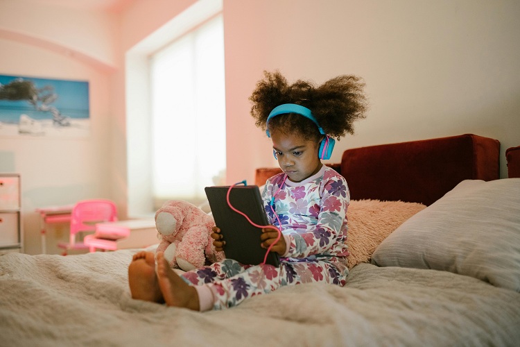 a kid is using tablet device